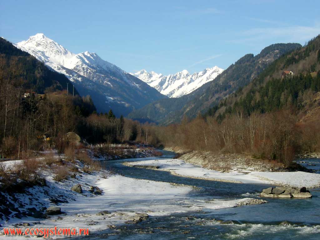Isel river valley, flowing from the southern slope of the Hohe Tauern mountain range. Far right - Mount Grossglockner – the highest mountain in Austria and Eastern Alps (altitude 3798 m), on the left – Mount Grossvenediger, height is 3674 m. Neighborhood of the village Ainet, Hohe Tauern National Park, Carinthia, southern Austria