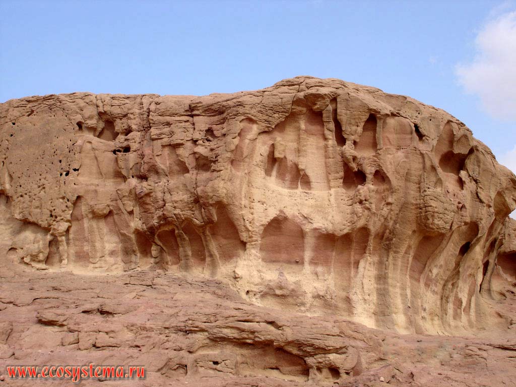 The edge of a small plateau with typical desert weathering (decay) forms