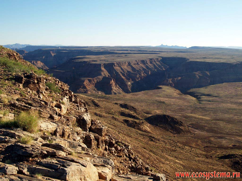 The stony edge of the Fish River Canyon. Ai-Ais / Richterveld Transfrontier National Park, Southern Namibia, South African Plateau