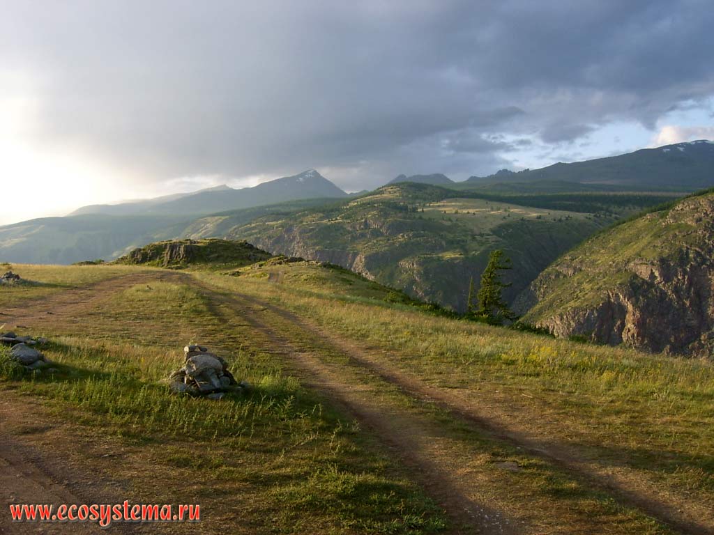 View of the Chulyshman Plateau from Ulagansky highland, separated by Valley Chulyshman discharge. Beyond - the territory of the Altai State Reserve with highest peak of about 3 thousand meters above sea level. Ulagansky District, Altai Republic
