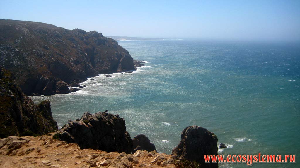 Escarpment of the Atlantic Ocean at Cape Roco (Cabo da Roca) - the extreme western point of Eurasia mainland. National Park of Sintra-Cascais on the west coast of Portugal. Iberian Peninsula