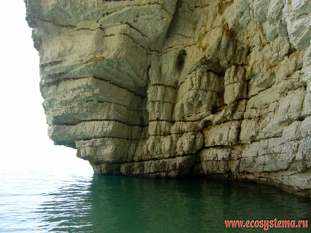 Escarpment - the result of the metamorphic rocks weathering in the Gulf of Manfredonia in Adriatic Sea. Near the town of Baia delle Zagare. Gargano National Park, province of Foggia, Apulia (Puglia) Region, Southern Italy