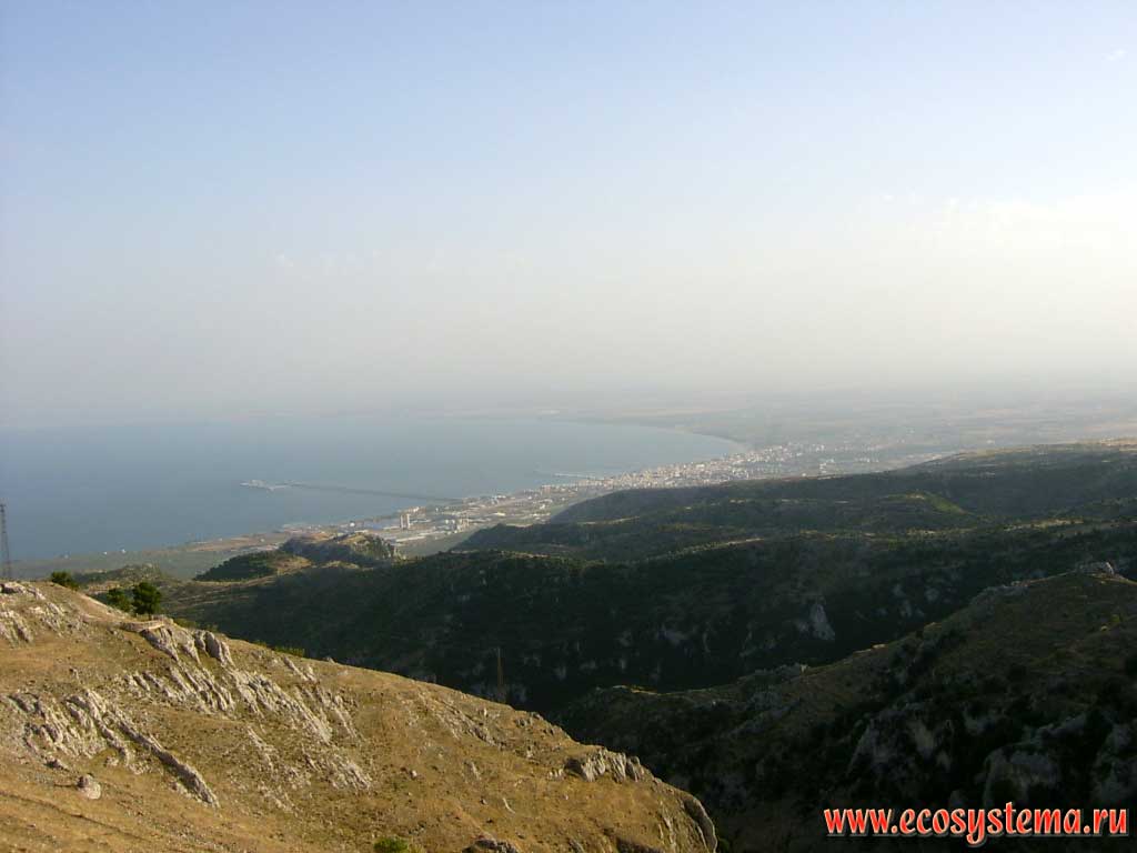 View of the city and the bay of Manfredonia in the Adriatic Sea from the Gargano plateau (from the town of Monte Sant' Angelo). Gargano National Park, province of Foggia, Apulia (Puglia) Region, Southern Italy