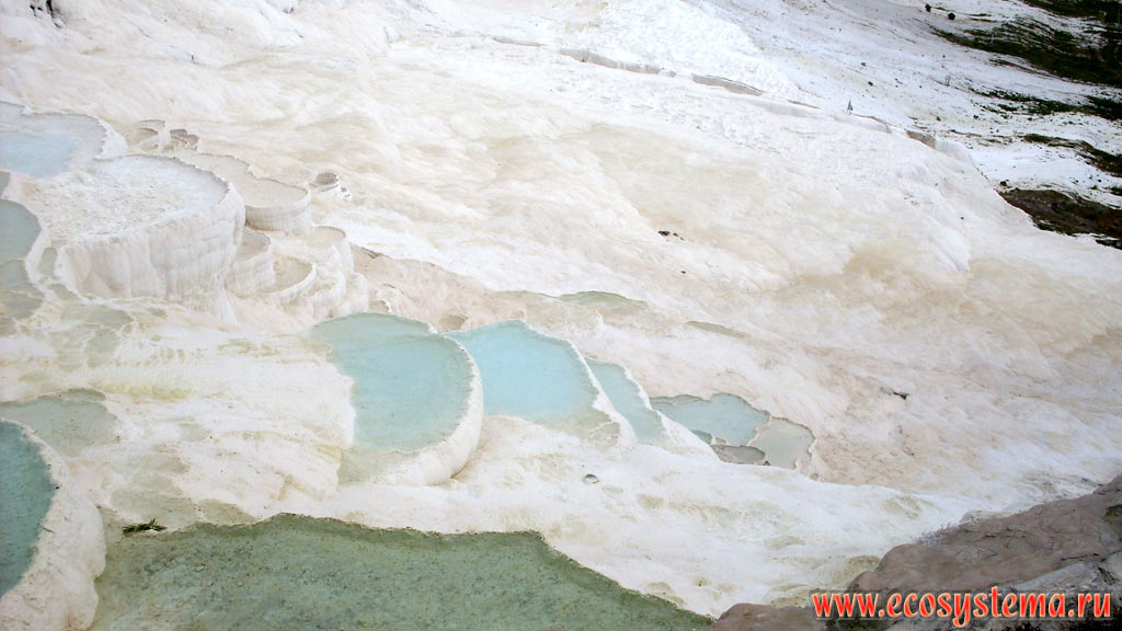 Terraces and baths of travertine – a sedimentary limestone rock formed from calcium carbonates, precipitated from carbonate hot spring waters. Pamukkale
