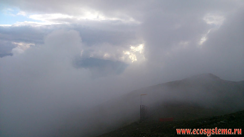 Clouds and fog on the tops of the mountain ranges of the Western Caucasus