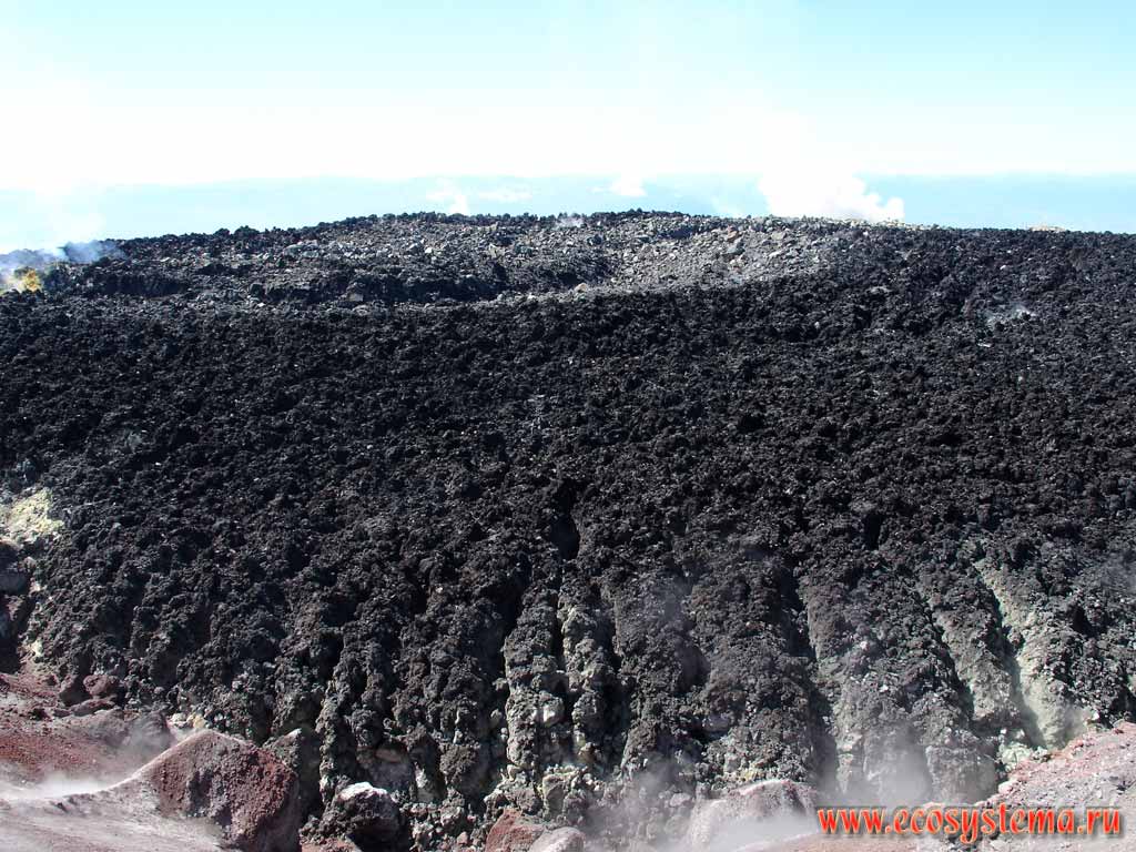 Lava stopper (plug) in the Avachinsky volcano crater.
Small fumarole and volcano sulfur sediments in the lava block basis