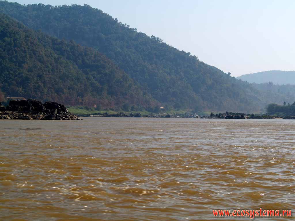 Mekong river middle current, cutting through Dai-Laung mountain system.
The humid tropic forests on the slopes of the mountains.