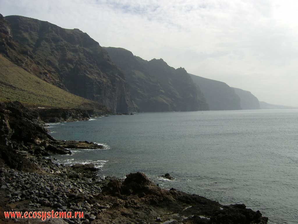 Coastal cliffs - open-cast of the volcanic barranco. Cliff height is about 500 meters.
Los Gigantes area, view from the Teno peninsula. North-west coast of the Tenerife Island, Canary Archipelago