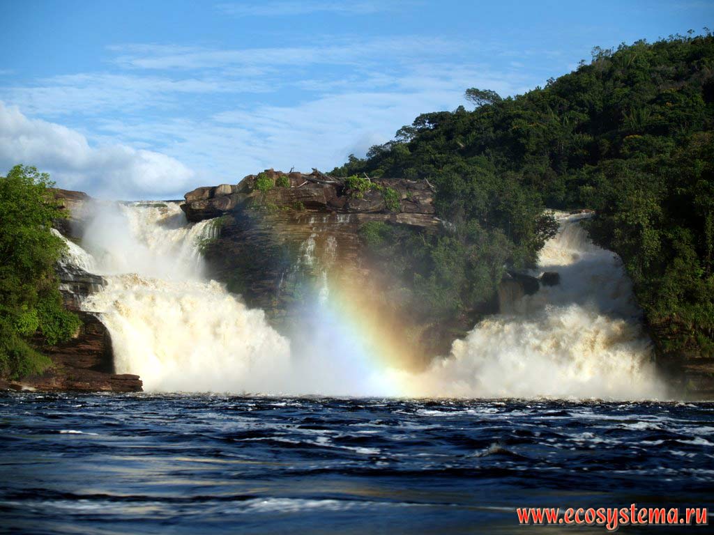 The rainbow over the Sapo, or Salto el Sapo (Frog, or Toad) waterfall on the Carrao River flowing down from the table mountain (mesa, or Tepui).
The Canaima Lagoon, humid tropical forest zone, Guiana Highlands, Canaima National park, Bolivar State, Venezuela