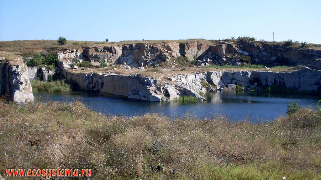 A small freshwater lake in an abandoned quarry for the extraction of stone