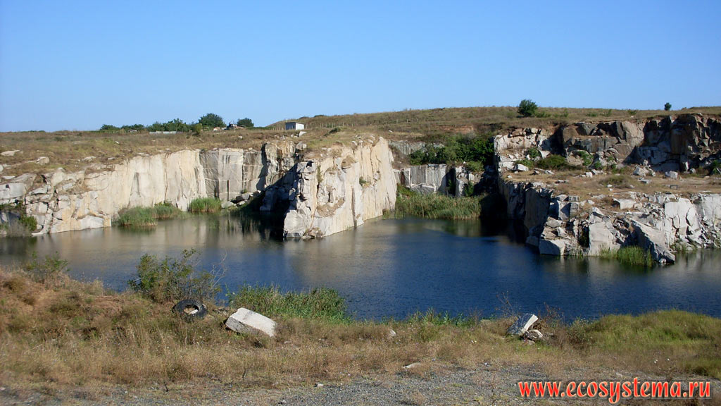 A small freshwater lake in an abandoned quarry for the extraction of stone