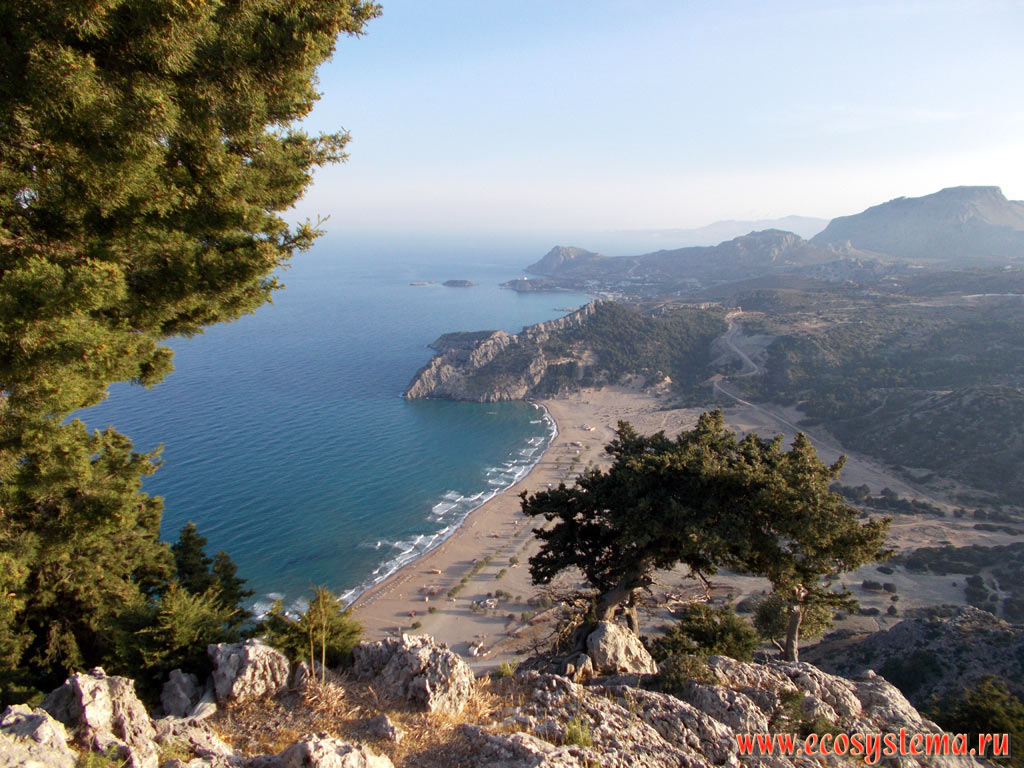 View of the Tsampika Beach, capes and bays of the Mediterranean Sea and the island of Archangelos in the distance on the Eastern (Mediterranean) coast of the island of Rhodes