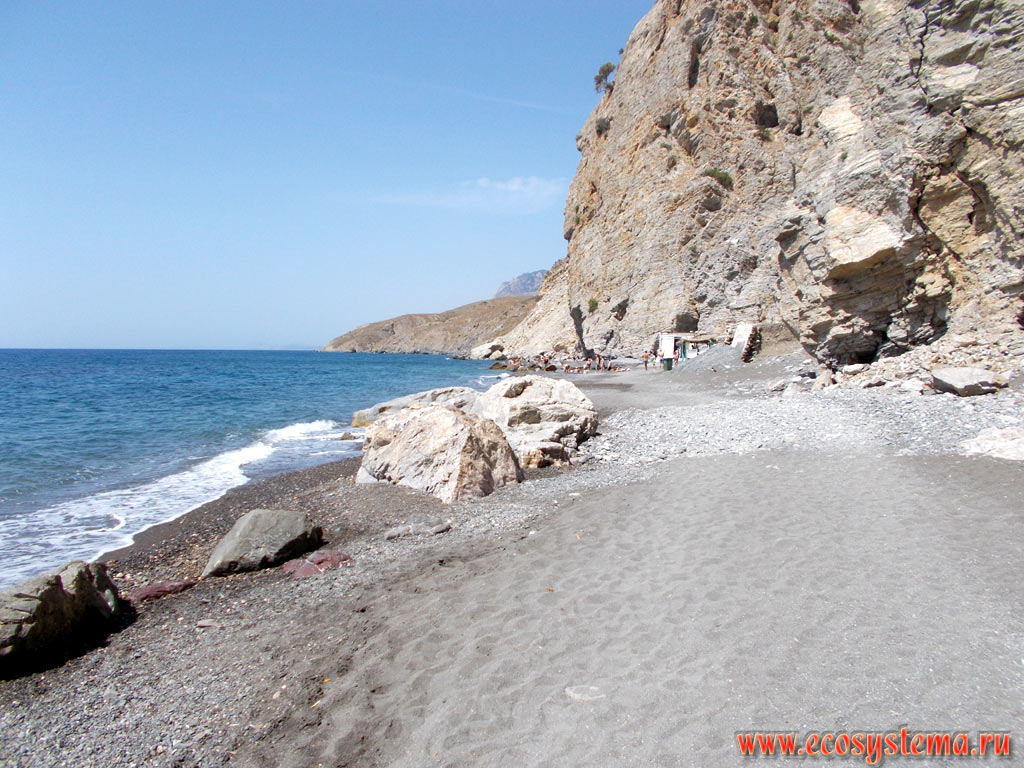 Abrasive shore of the Aegean Sea and rocky cliffs in the area of Therma Beach hot springs near the village of Agios Fokas on the South-Eastern coast of the island of Kos