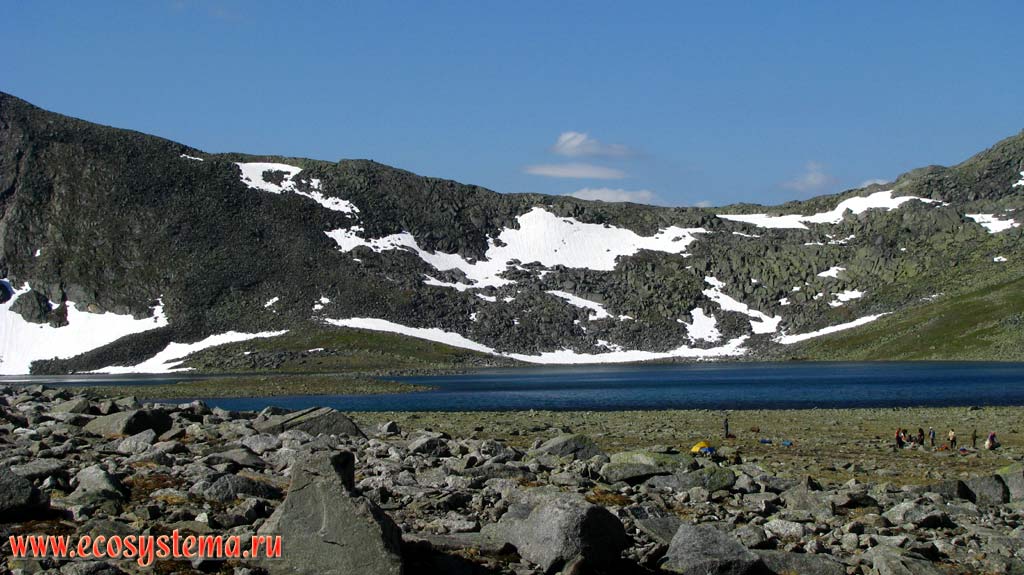 Mountain oligotrophic (cirque) lake in the circus (quads), surrounded by tundra vegetation. Subpolar Urals, Yugyd-Va National Park, the Komi Republic