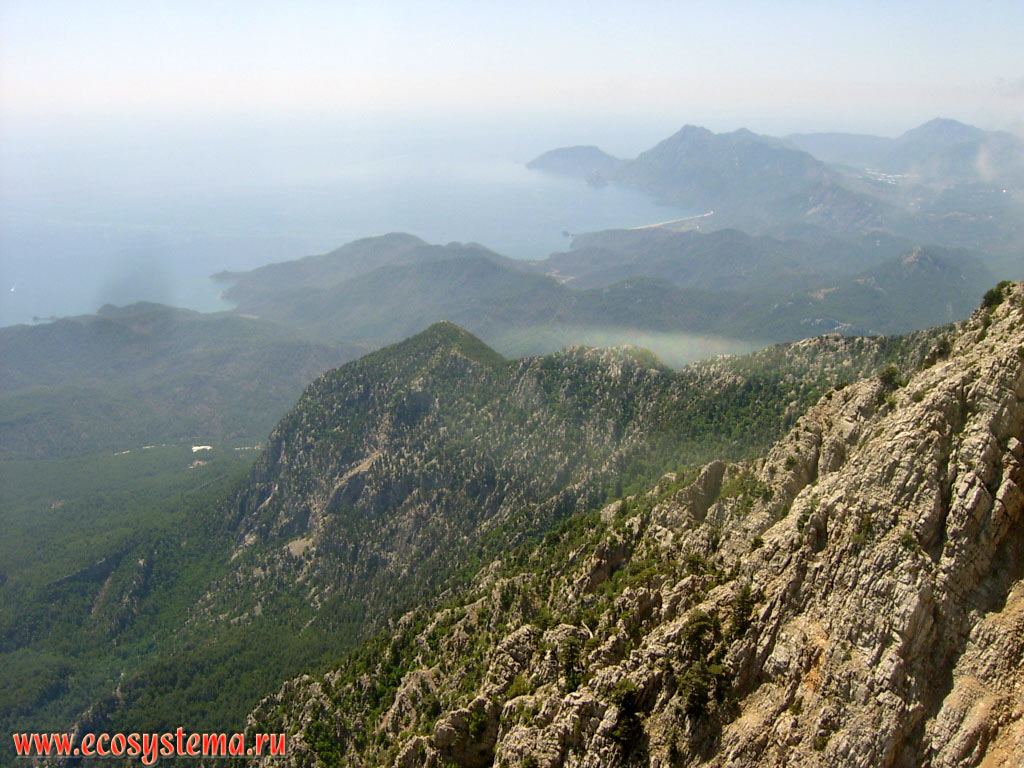 View of the Mediterranean coast to the south of Kemer (between the towns of Tekirova and Cirali), on the spurs of the mountain range of Beydaglari and the peninsula of Atbuk from the top of the Tahtali Dag